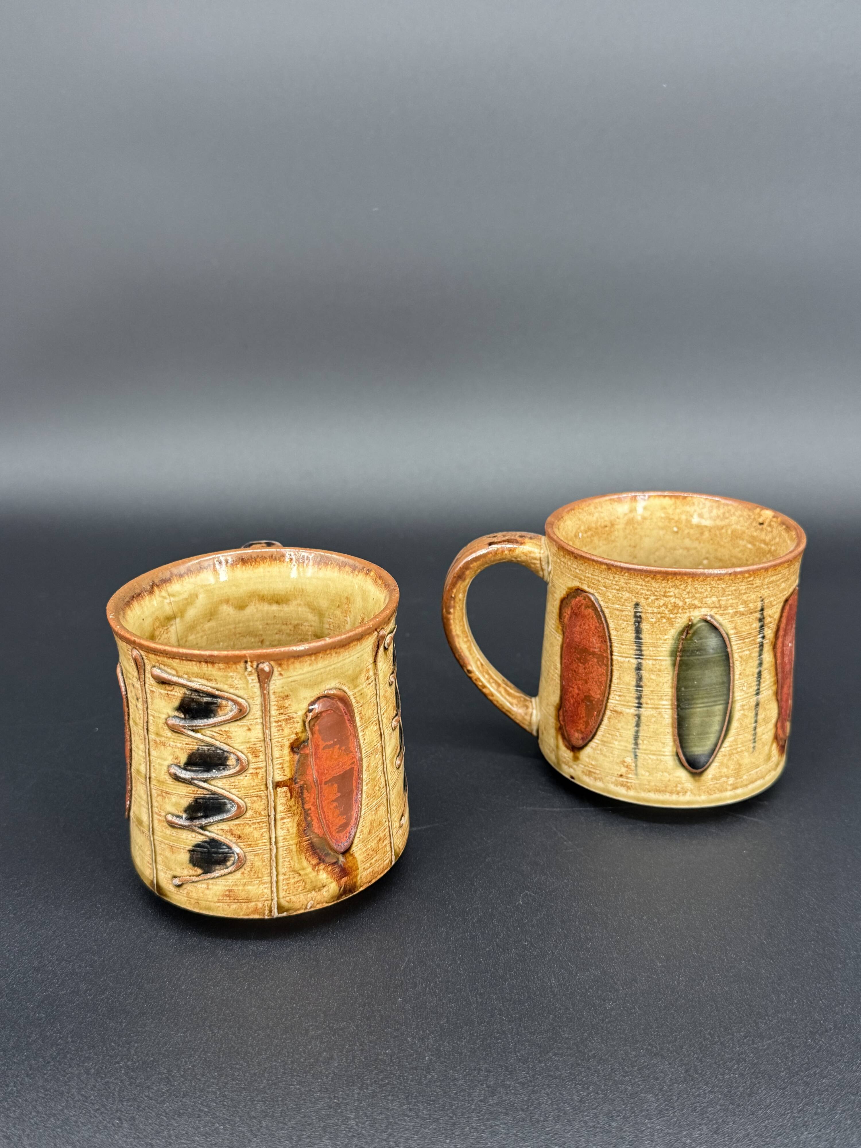 Pair of glazed stoneware mugs — abstract decor from the 70s