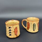 Pair of glazed stoneware mugs — abstract decor from the 70s