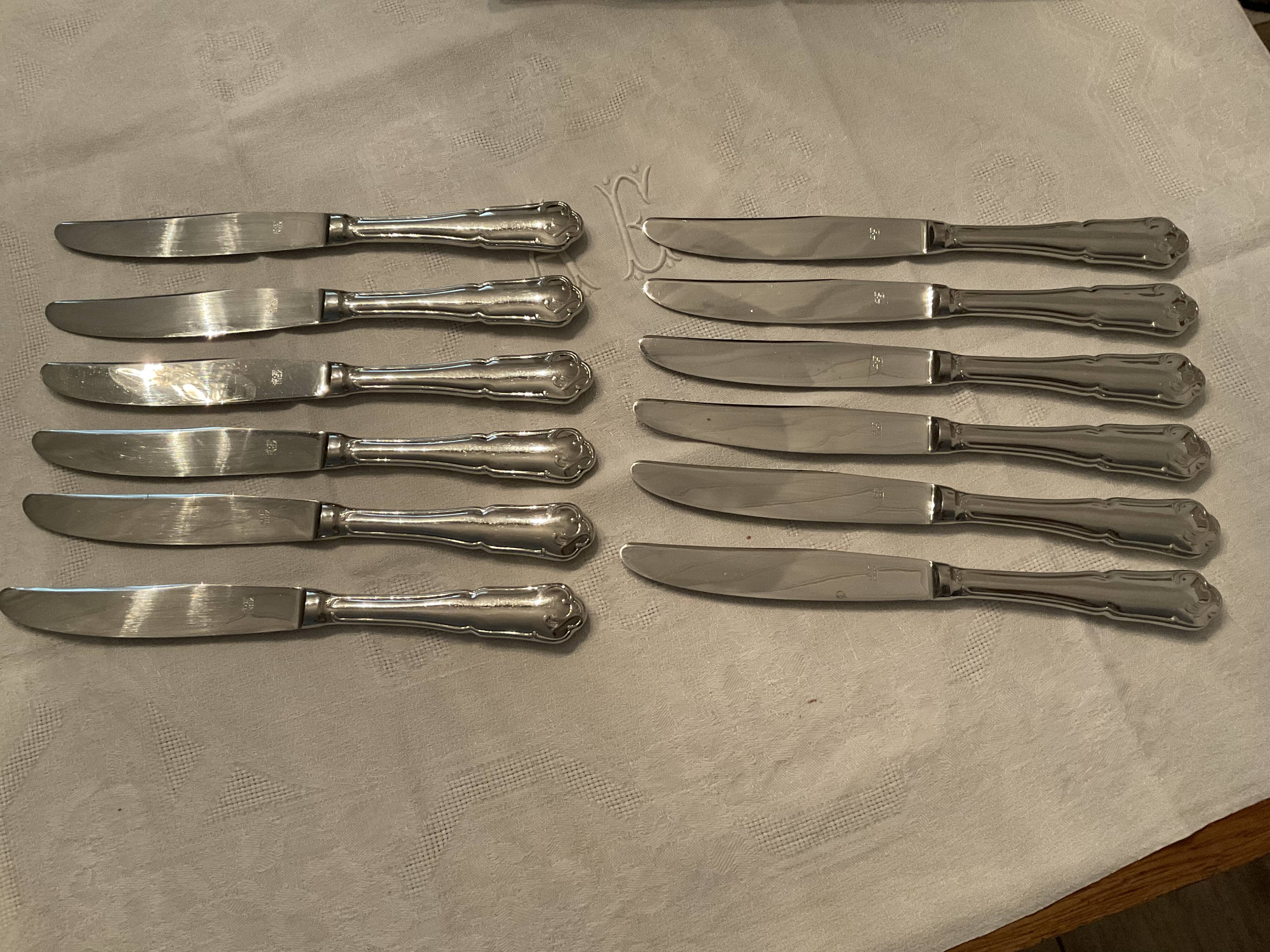 12 stainless steel knives. vintage