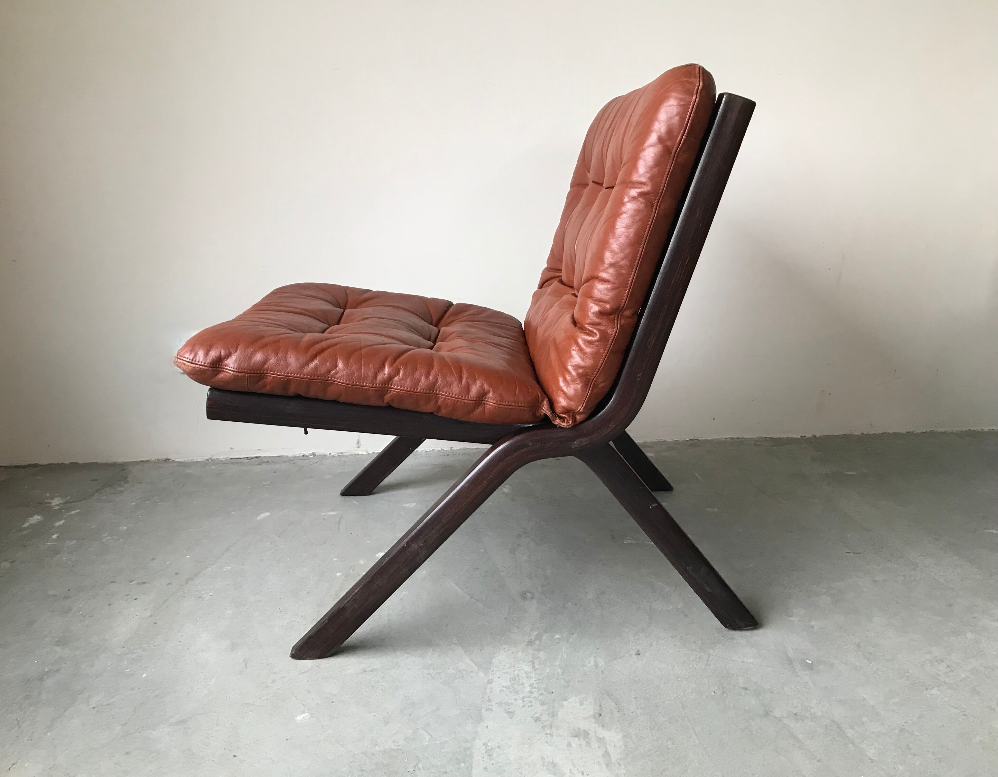 Scandinavian folding armchair in cognac leather