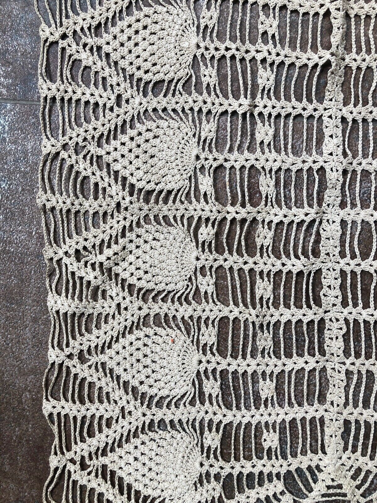 Old oval doily made by hand in beige crochet