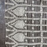 Old oval doily made by hand in beige crochet