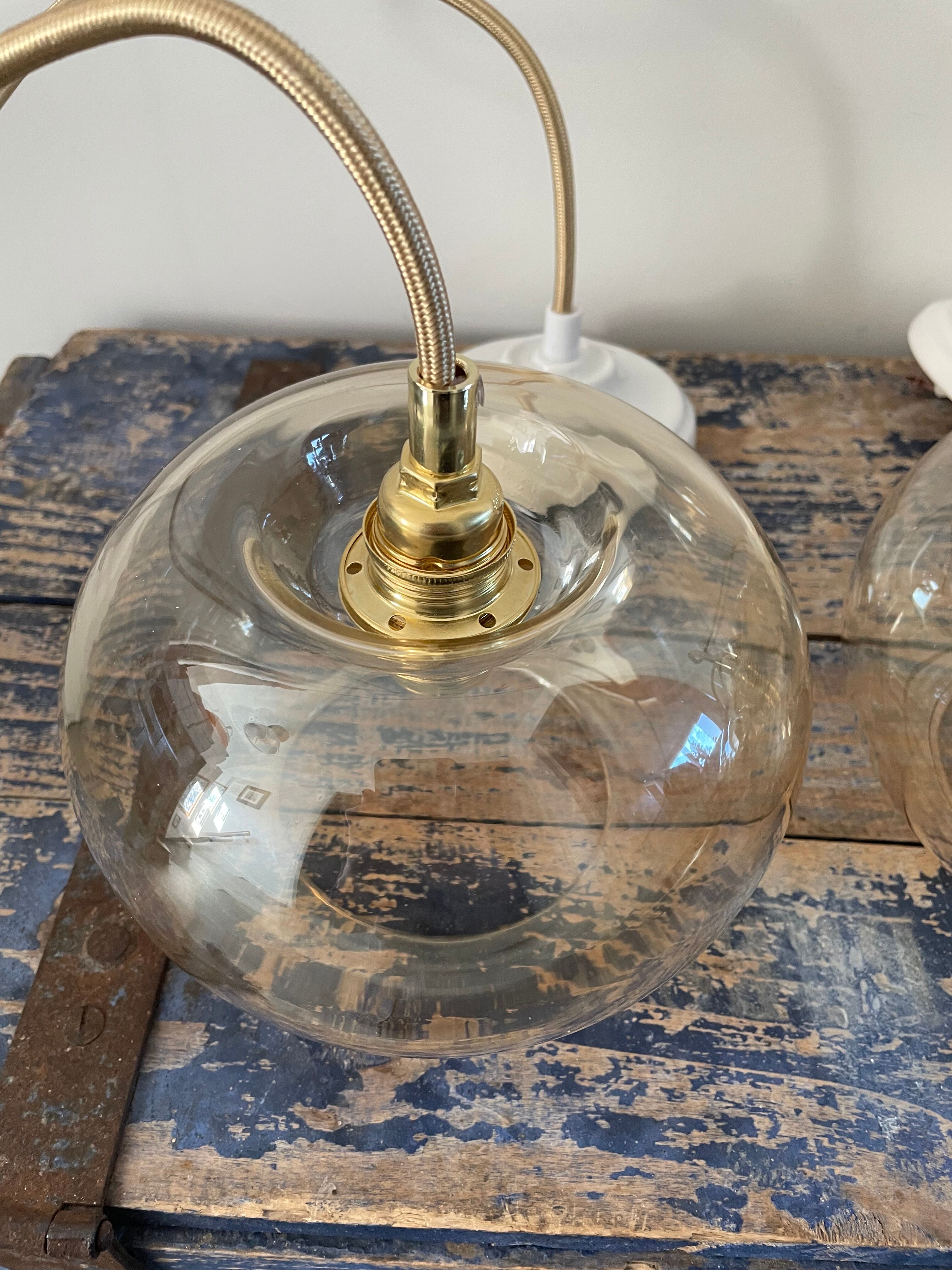 Set of three glass hanging lamps