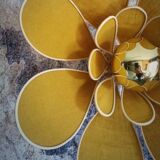Flower wall light made of rattan and saffron linen petals