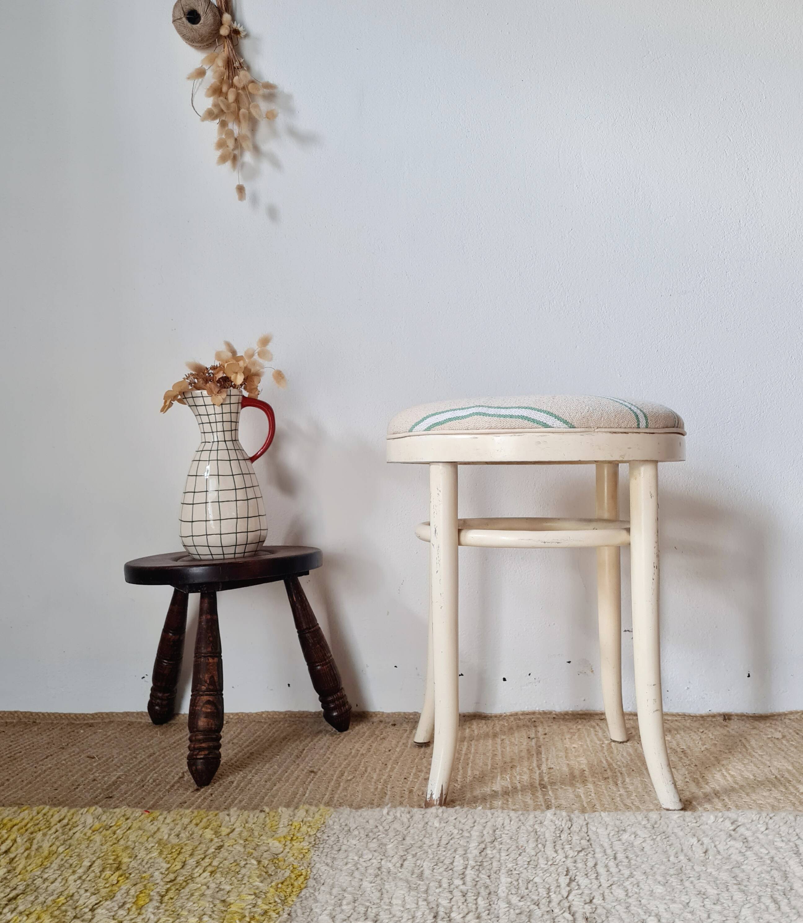 Vintage curved wooden stool in Baumann style, striped fabric seat.