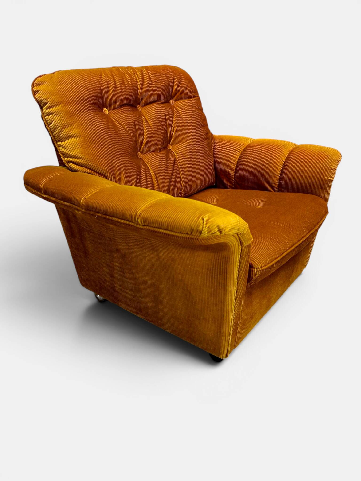 Vintage lounge chair on wheels in golden mustard corduroy 70s