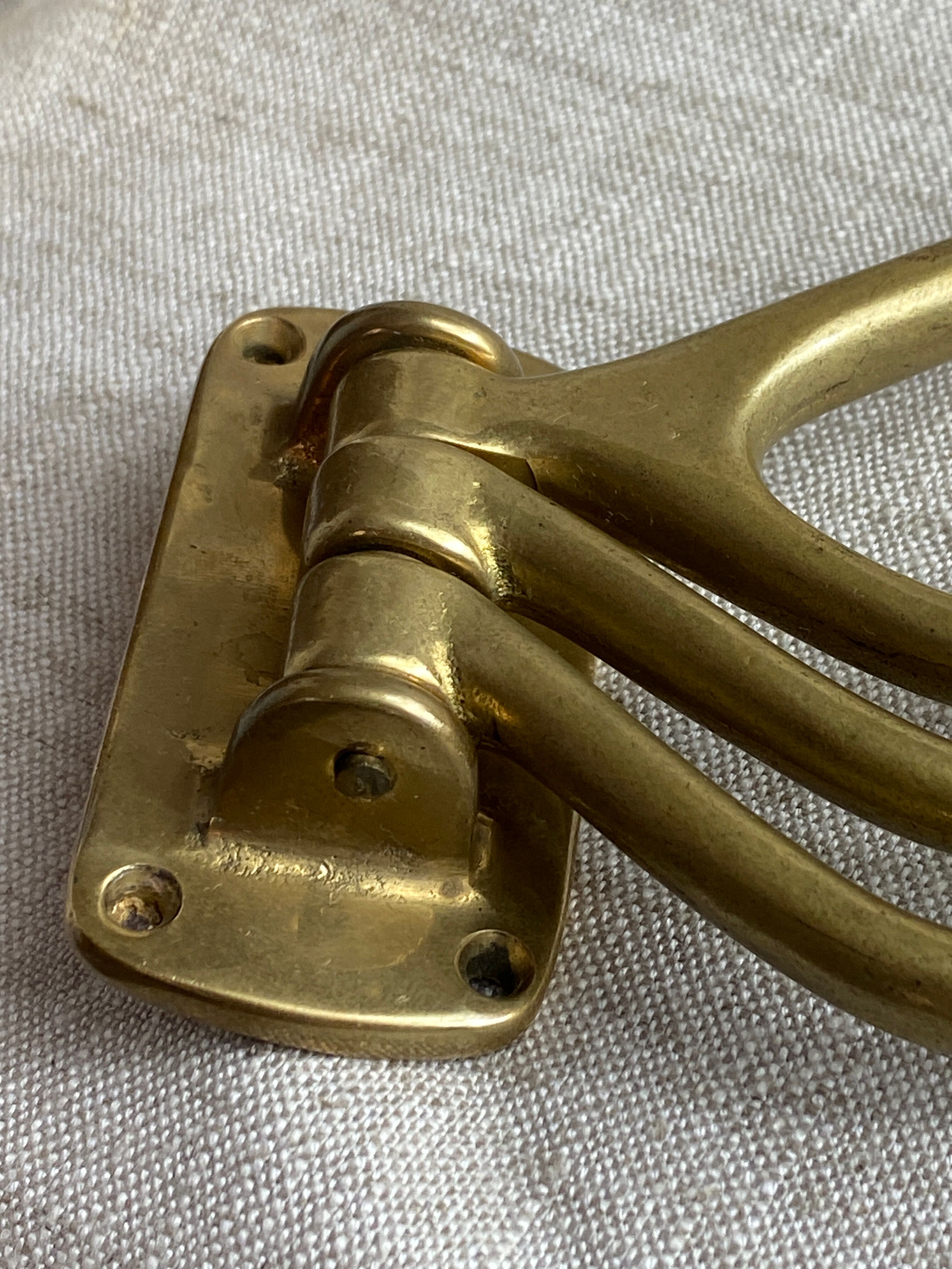 Adjustable nautical coat hook in solid brass