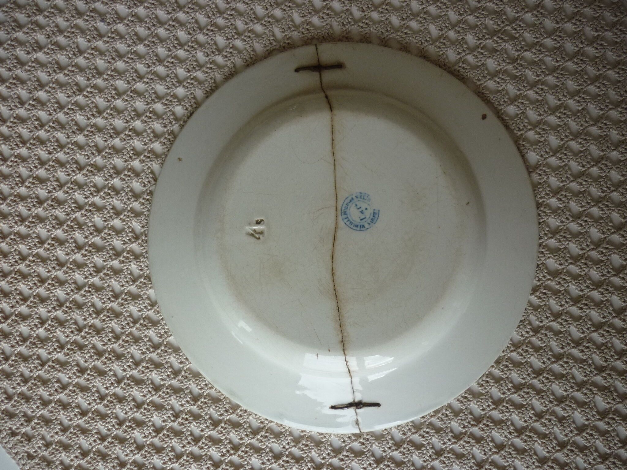 Old repaired plate stapled