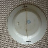 Old repaired plate stapled