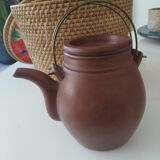 Chinese terracotta teapot with its basket