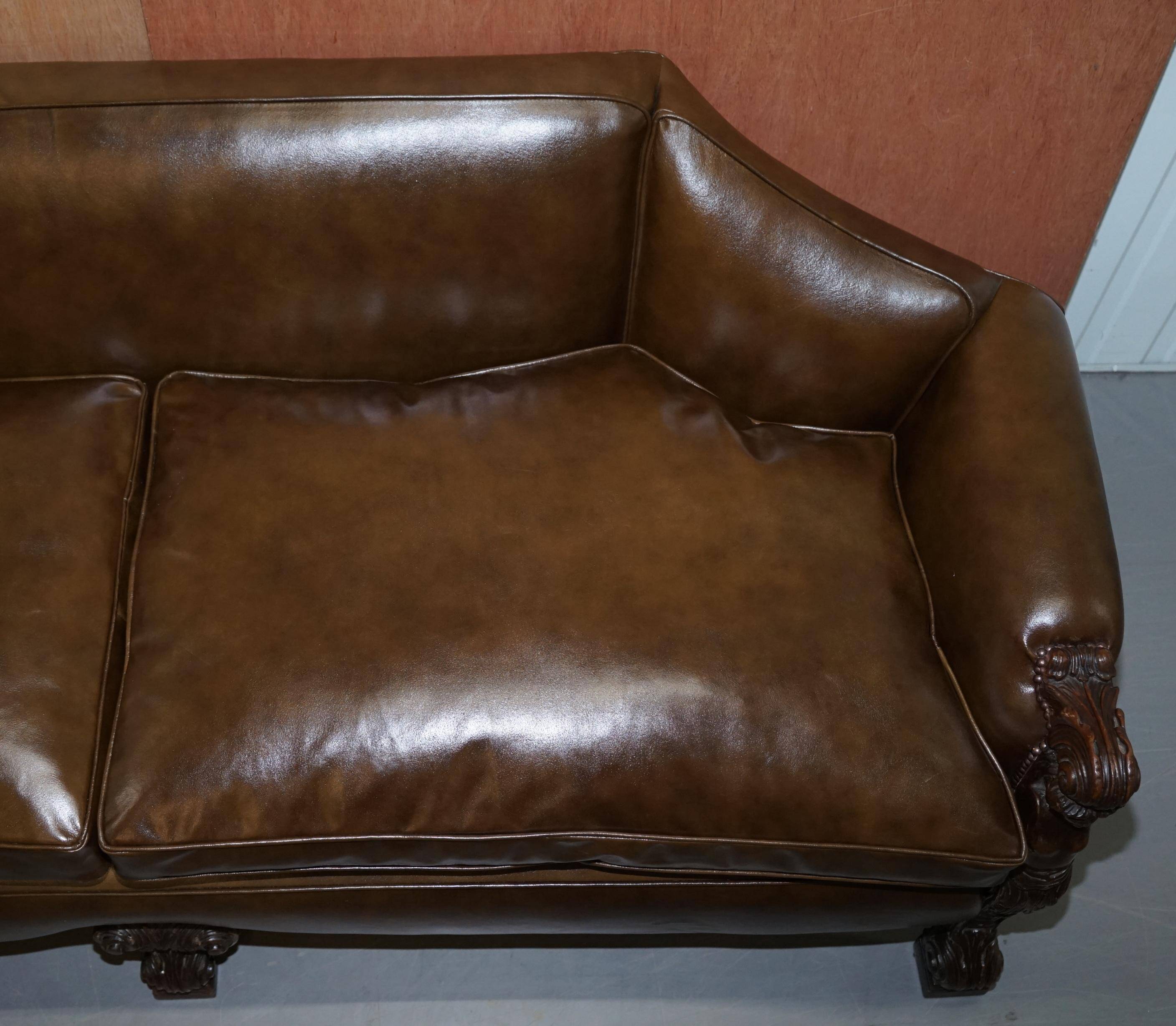 Restored Regency canapé in leather with sculpted Hermès frame.