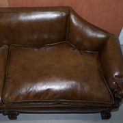 Restored Regency canapé in leather with sculpted Hermès frame.
