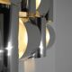 Contemporary wall light in stainless steel and metal.