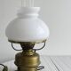 Vintage brass lamp with white opaline glass shade.