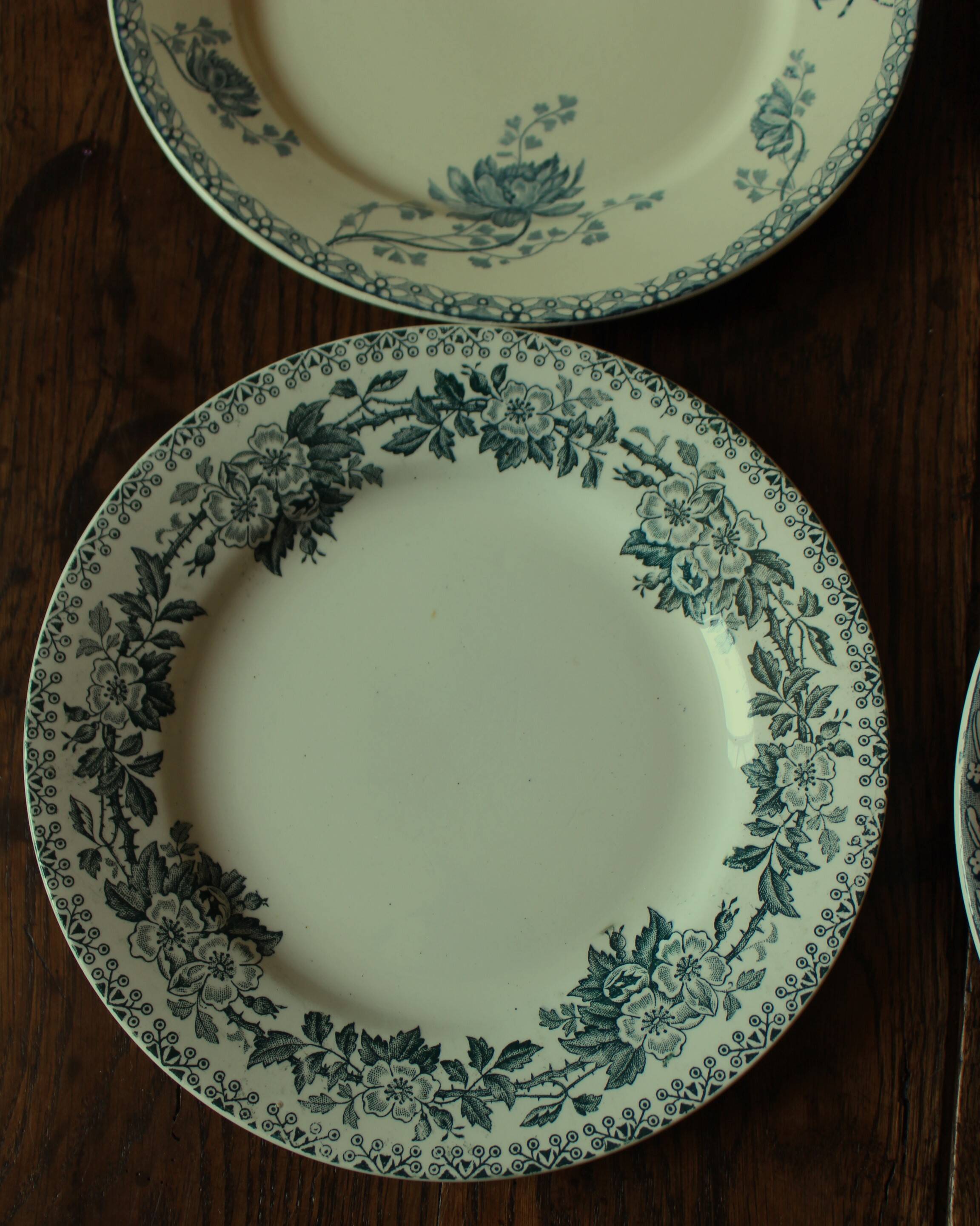 Set of 4 mismatched blue flat plates