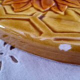 Vintage yellow earthenware cheese dish with sunflower decor and wrought iron handle