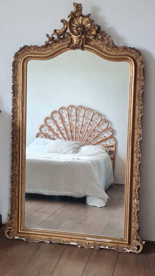 Antique Louis Philippe mirror with a pediment.