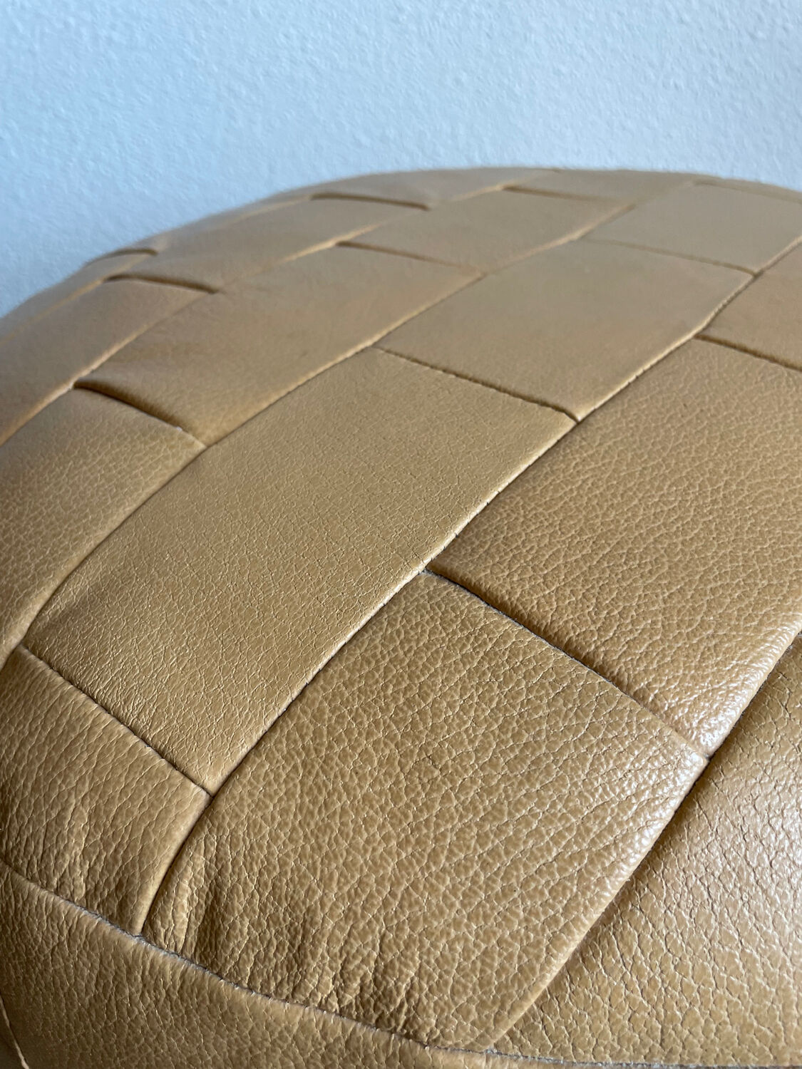 Beige patchwork leather pouf from Sède
