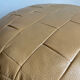 Beige patchwork leather pouf from Sède