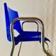 Vintage high chair for children in chrome metal and blue plastic