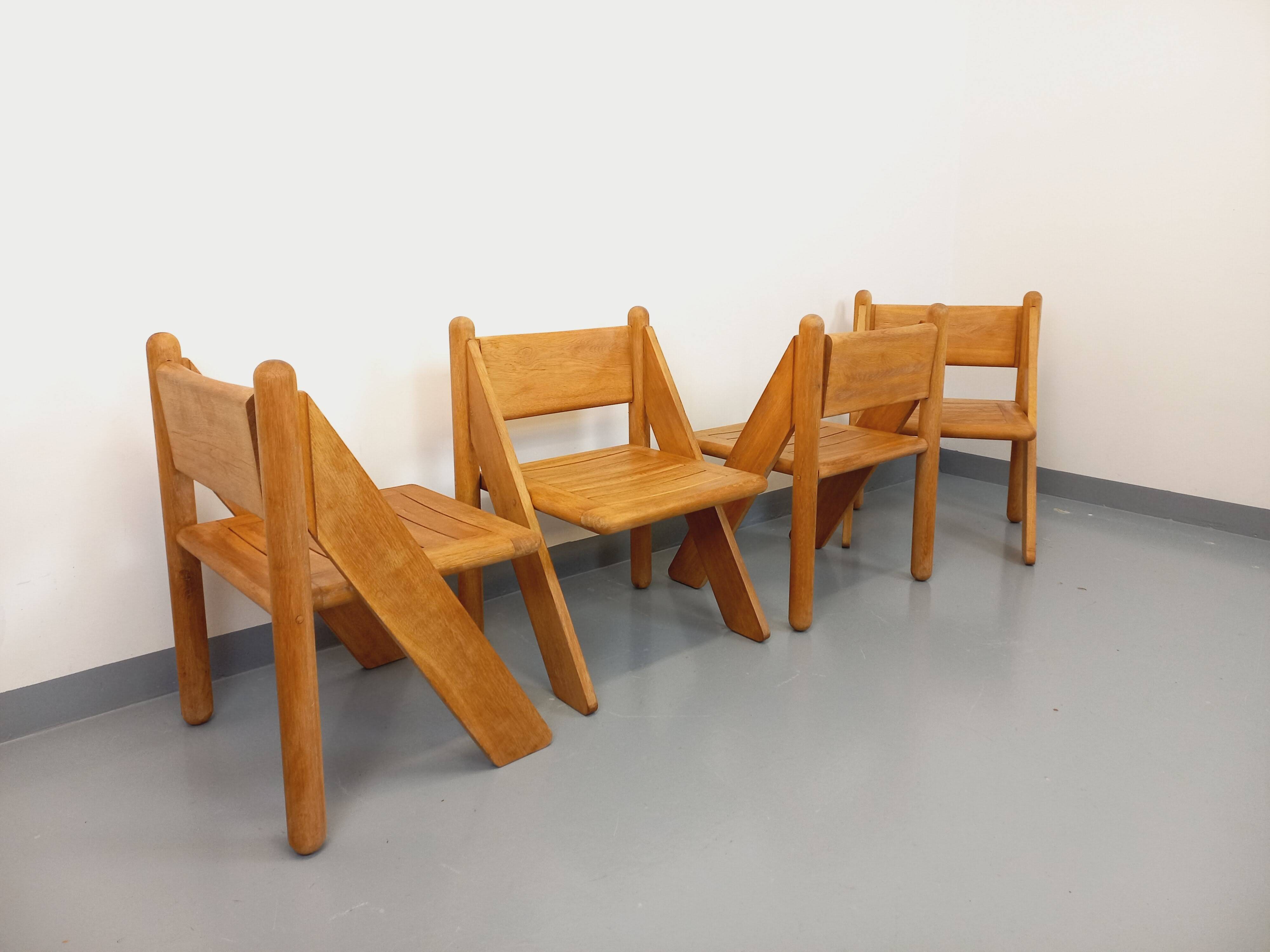 Set of 4 vintage brutalist chairs in solid oak from the 1960s.
