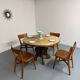 Round table in solid wood, thick top, vintage brutalist style from the 1960s.