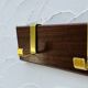 Vintage wooden and brass coat rack with 3 hooks from the 1960s.