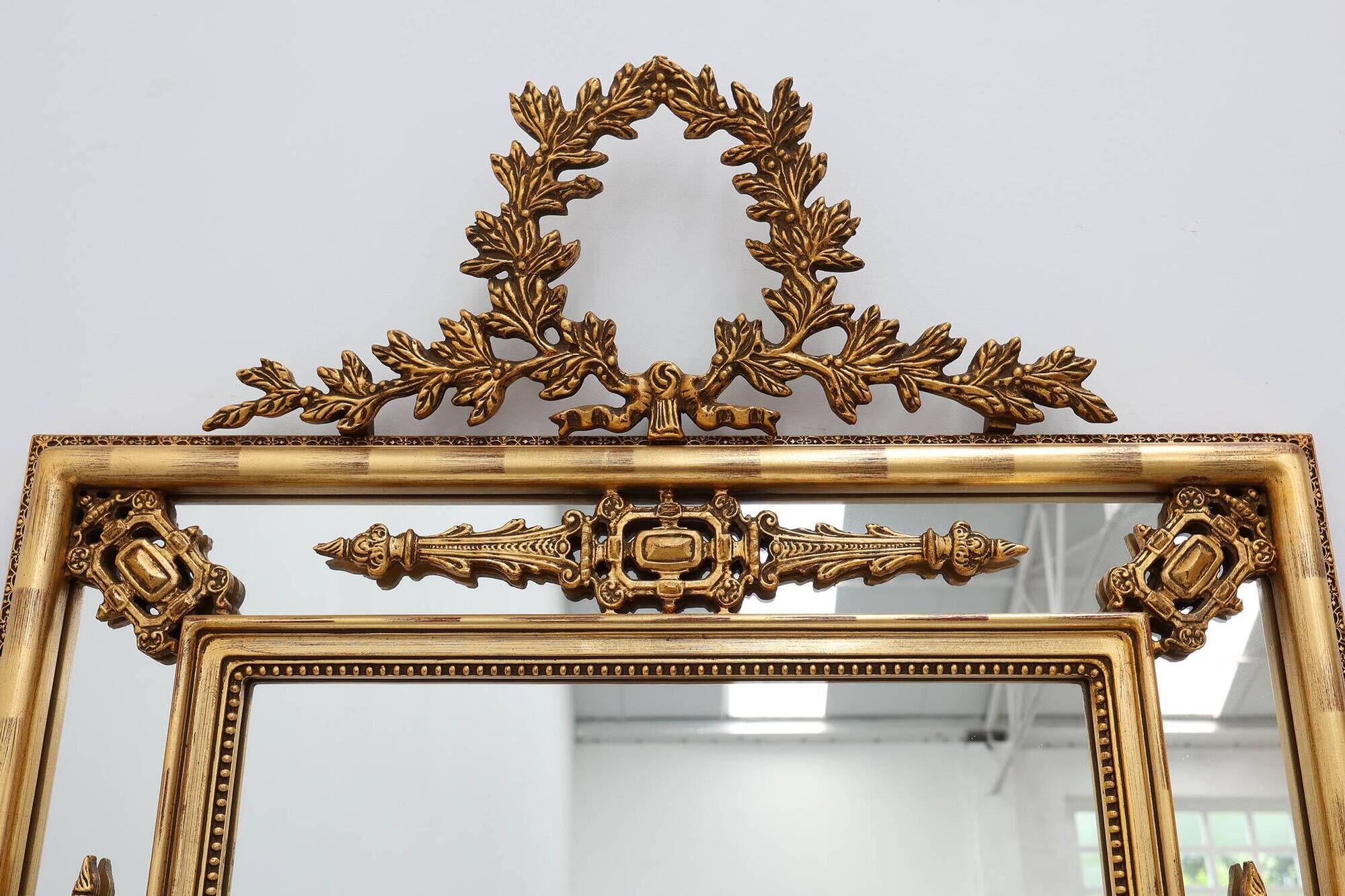 Louis XVI style gilt mirror with laurel wreath crest, Belgium, 20th century
