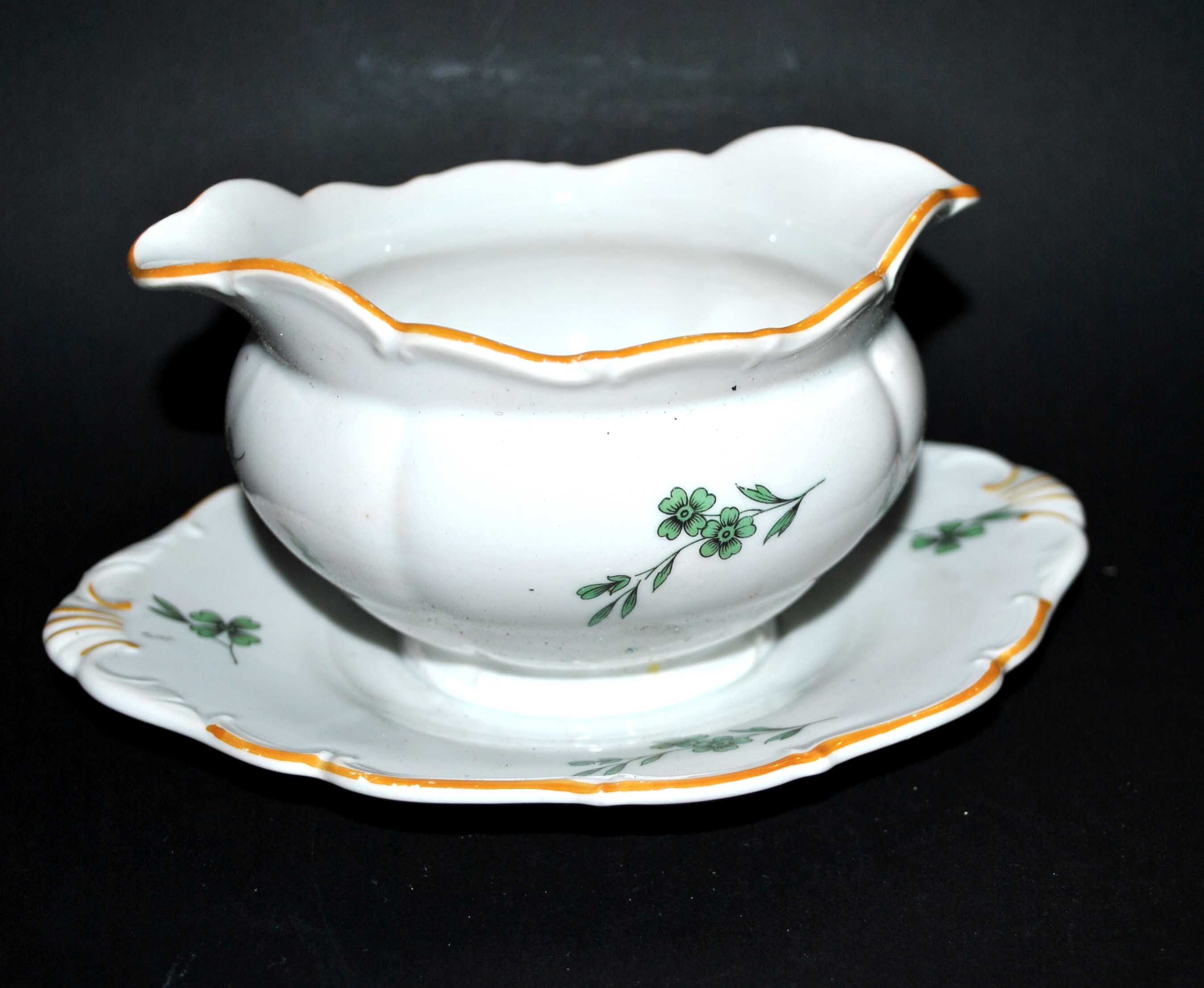 Vintage porcelain pouring saucière decorated with green clover