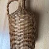 Dame jean covered in woven wicker