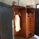 Old black wardrobe - wooden drawers and labels of origin