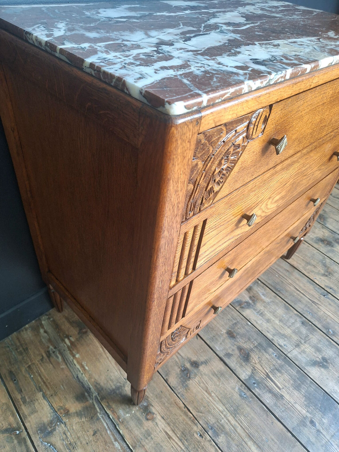 Art Deco commode with marble top, vintage antique furniture.