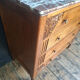 Art Deco commode with marble top, vintage antique furniture.