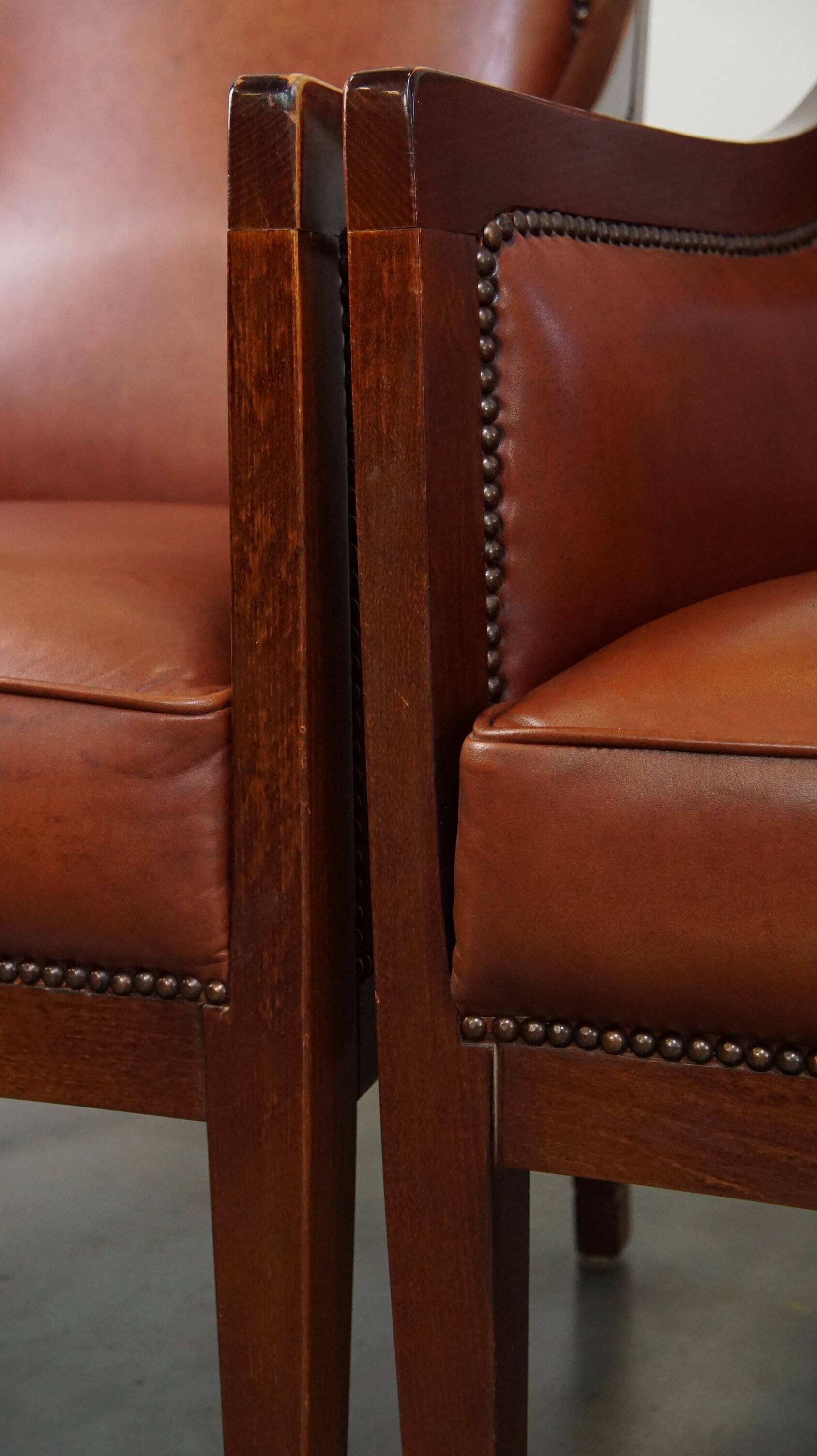 Ensemble majestueux et luxueux de 4 fauteuils design Art Déco en cuir de vachette couleur cognac