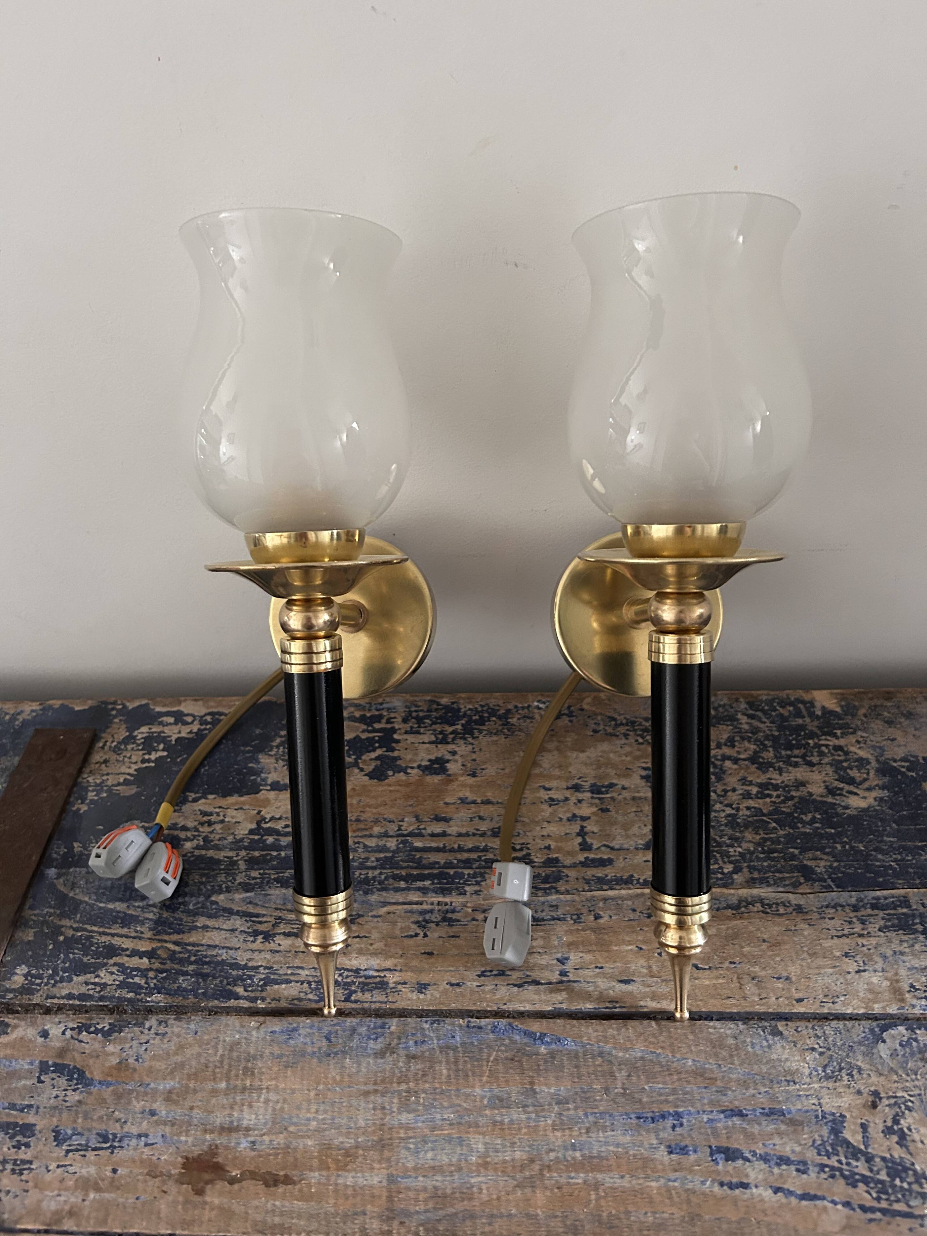 Pair of brass and black torchiere wall lights