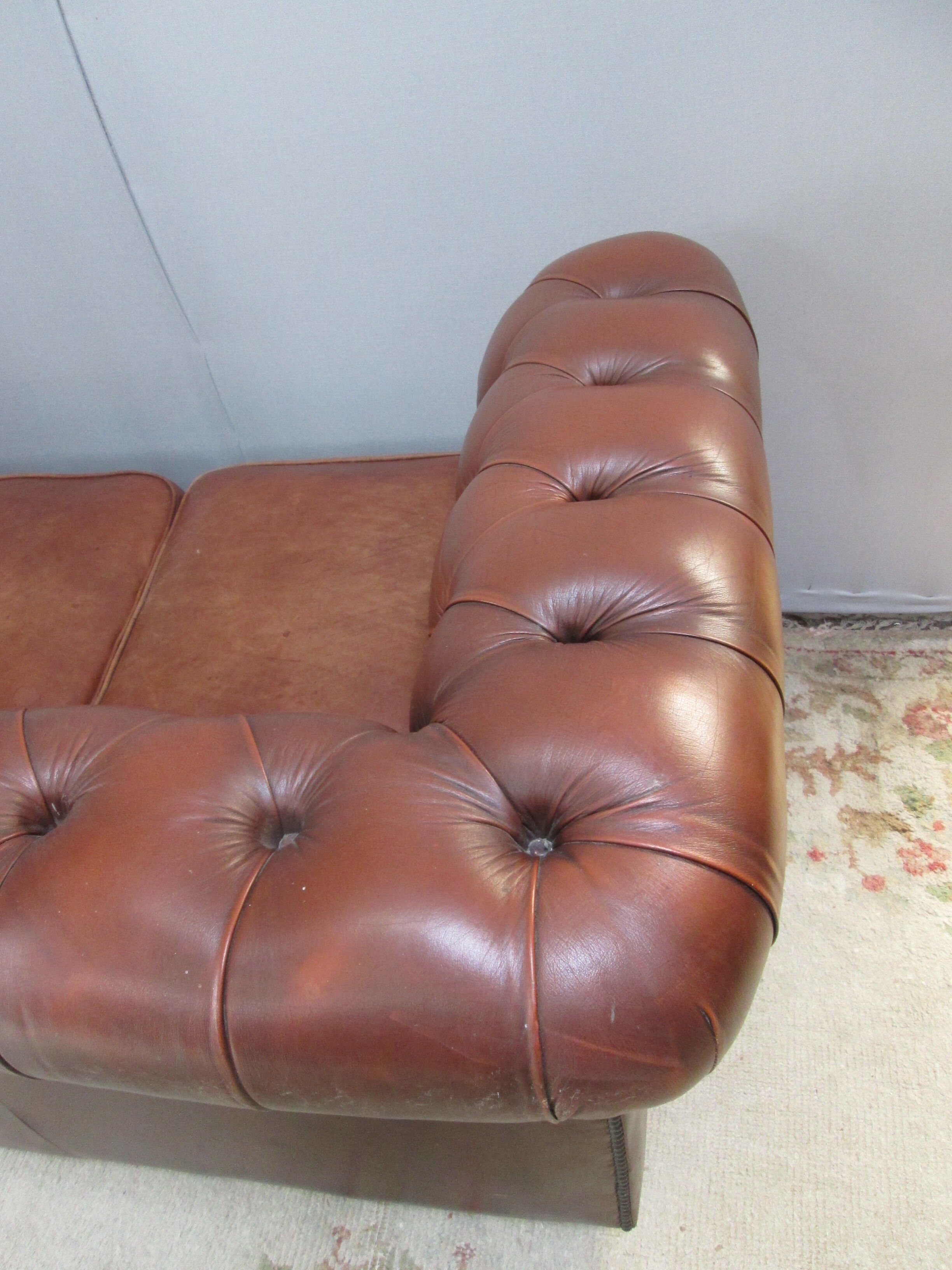 Brown leather chesterfield sofa