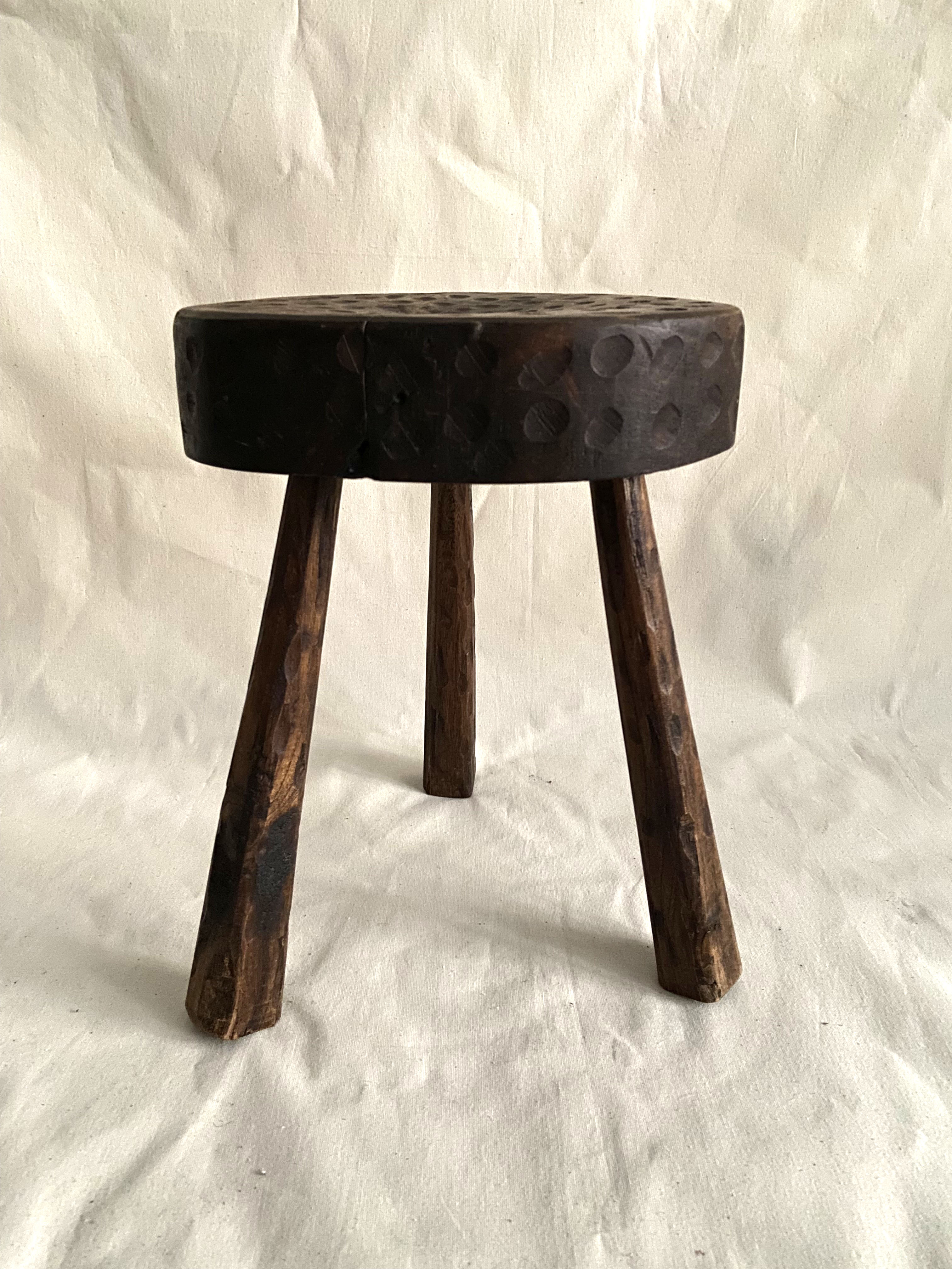Brutalist tipode stool in carved wood