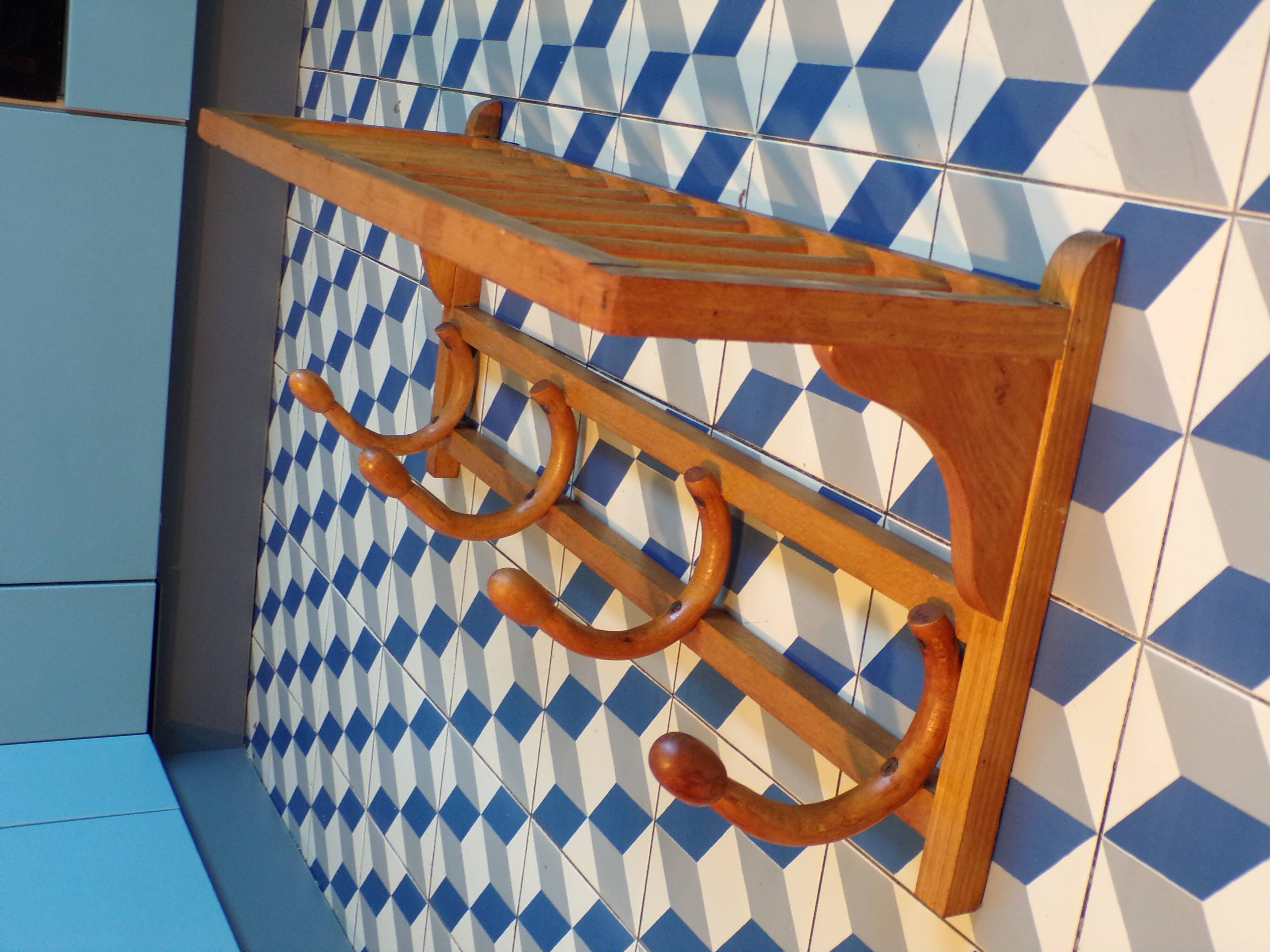Curved wooden coat rack with shelf