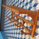 Curved wooden coat rack with shelf