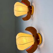 Pair of pear-shaped "Cocoon" wall sconces, resin and pine wood, Italy, circa 1970s