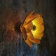 Flower wall light made of rattan and raffia petals
