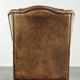 Sheepskin wingback armchair with patina finished with decorative nails