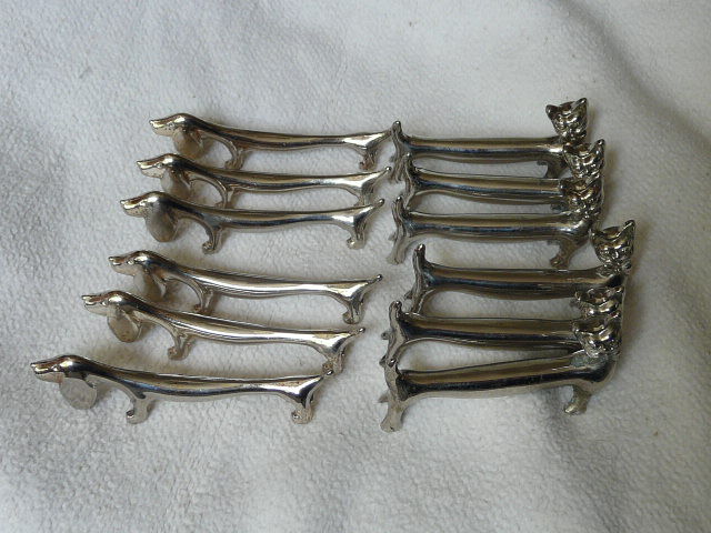 12 silver metal knife holders 6 dogs and 6 cats