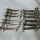 12 silver metal knife holders 6 dogs and 6 cats
