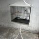Mid-century pagoda bird cage on stand — white & black metal with brass accents