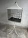Mid-century pagoda bird cage on stand — white & black metal with brass accents