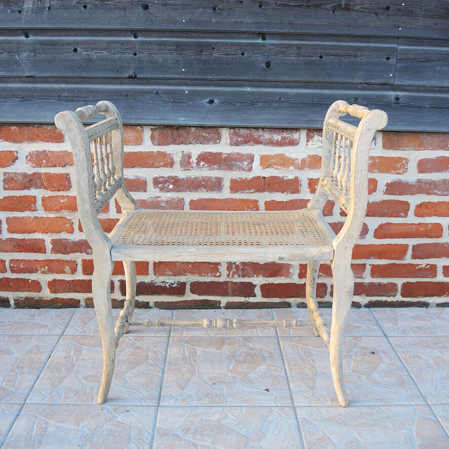 Antique Napoleon III piano bench in wood and cane.