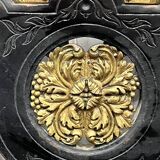 Blackened wooden shelf.