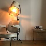 Vintage hairdresser's armchair with helmet transformed into a lamp