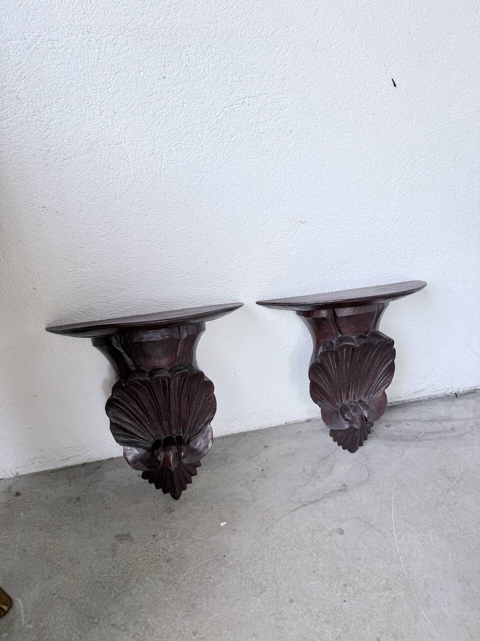 Pair of carved Italian wall consoles
